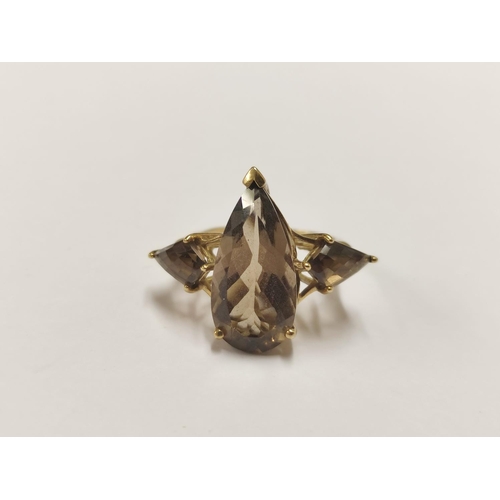 86 - 9ct gold and smoky quartz dress ring, 5g gross.