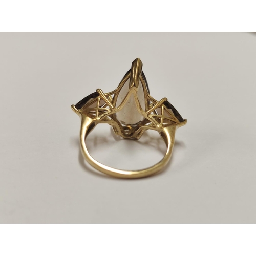86 - 9ct gold and smoky quartz dress ring, 5g gross.