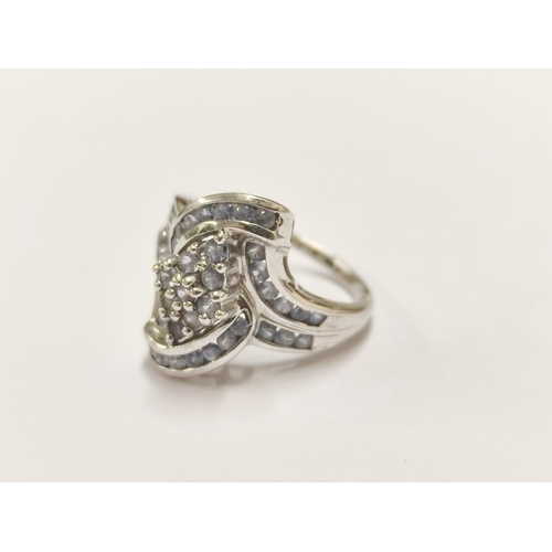 94 - 9ct gold lady's ring set with multiple blue-coloured stones, 4.6g gross.