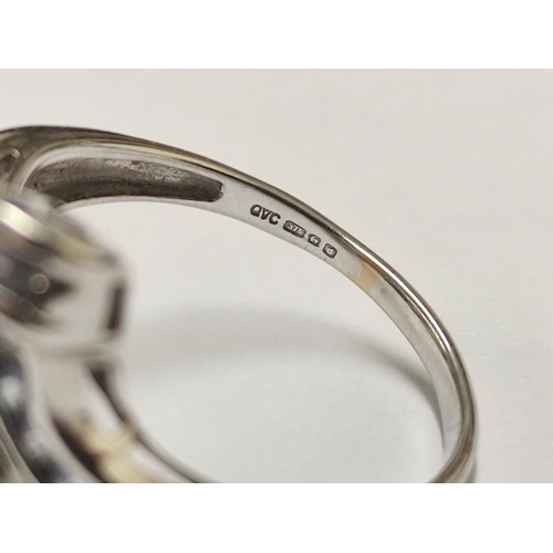 94 - 9ct gold lady's ring set with multiple blue-coloured stones, 4.6g gross.