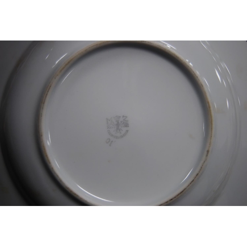 125 - Collection of Bavarian and Czechoslovakian porcelain dinnerwares, some with gilt decoration.