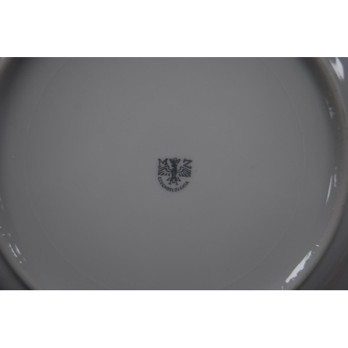 125 - Collection of Bavarian and Czechoslovakian porcelain dinnerwares, some with gilt decoration.