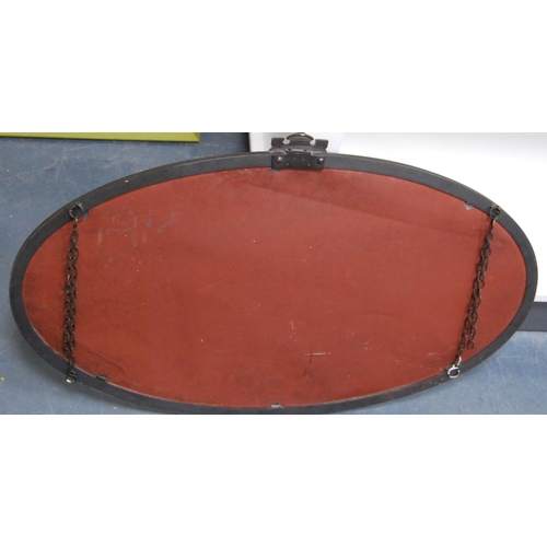 162 - White metal-mounted oval wall mirror.