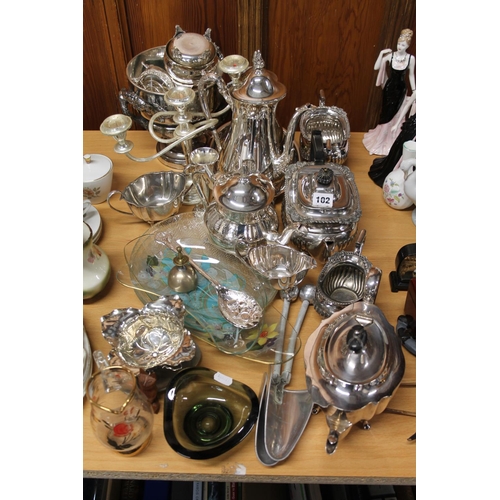 102 - Silver-plate to include a three-piece tea service, a twin-handled bowl, a candelabra, etc.