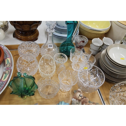 232 - Glassware to include vases, a rose bowl, decanters, glasses, jugs, etc.