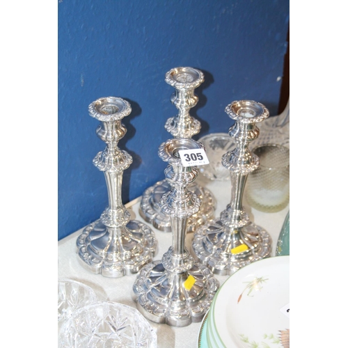 305 - Four silver-plated candlesticks.