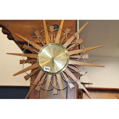 324 - Piaco sunburst wall clock.