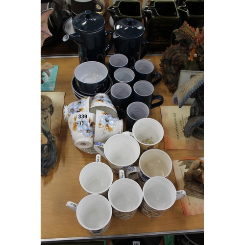 339 - Wellhouse Pottery blue ground teaset, mugs, and a floral part teaset.