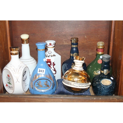 343 - Collection of empty whisky decanters to include Royal Salute, Dimple, Glenfiddich, etc.