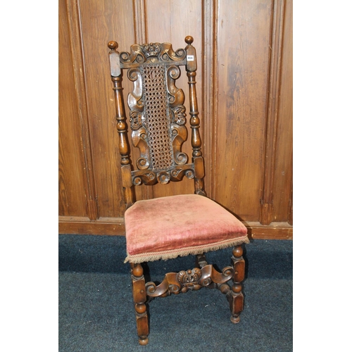 404 - Cared oak bergere back chair with crown surmount.