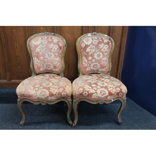 405 - Pair of floral upholstered salon chairs, raised on cabriole supports.