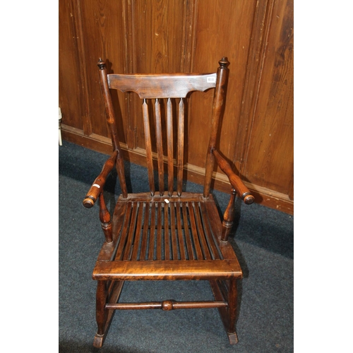 418 - Oak spar back and seated rocking chair.