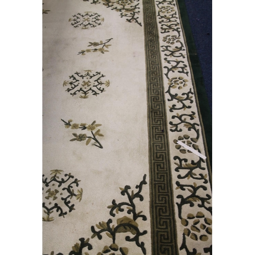 441 - Cream and green ground large carpet, with Greek key border, 365 x 264cm.