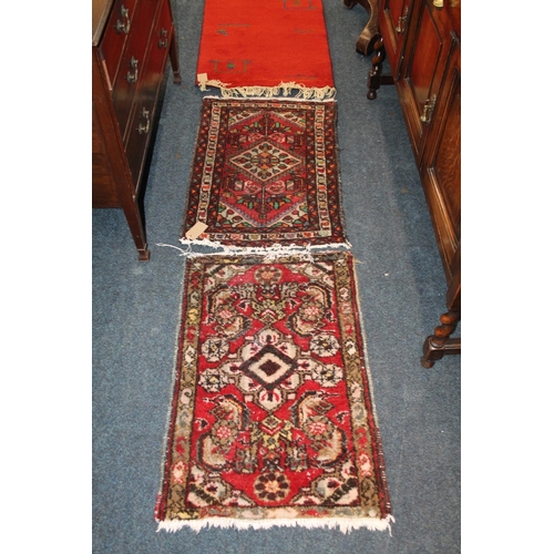 442 - Two Eastern small rugs or mats, and another.  (3)