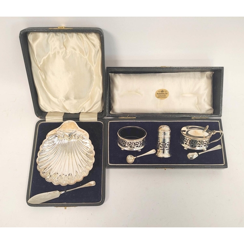 61 - Silver three-piece condiment set with spoons, 1919, & a butter shell, with knife, both cased. 12... 