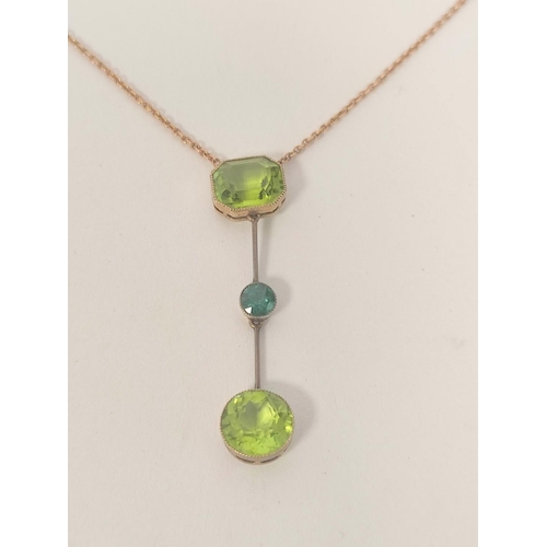 64 - Gold pendant with circular peridot dependant by a zircon from another, Wheatley case, c1900. 3g