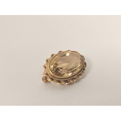 69 - Citrine oval brooch, a similar pin, both 9ct gold and a brooch with garter mount. 14g gross (2).