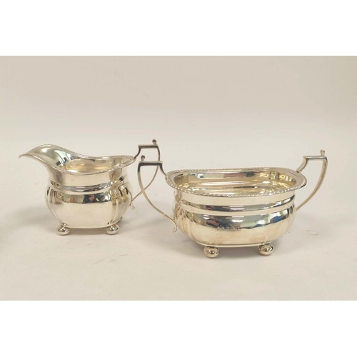 77 - Silver three-piece tea set, boat shape with gadrooned edges, by Elkington & Co. Birmingham 1967,... 