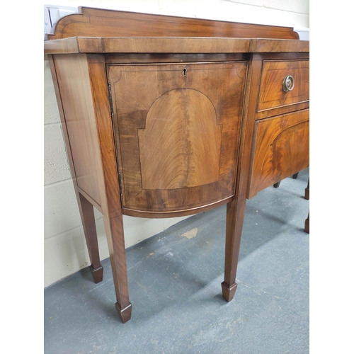 466 - Edwardian mahogany sideboard in the Sheraton style with ledge back and curved corner cupboards, cent... 