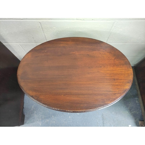 472 - Early 20th century oval mahogany occasional table on square supports with X understretchers. W.53cm.