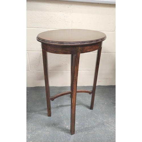 472 - Early 20th century oval mahogany occasional table on square supports with X understretchers. W.53cm.