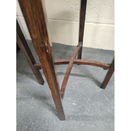 472 - Early 20th century oval mahogany occasional table on square supports with X understretchers. W.53cm.