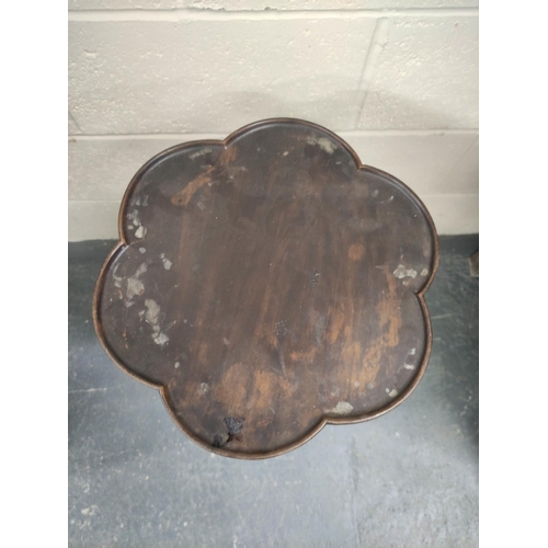 479 - Edwardian mahogany wine table, the lobed circular top on ring and leaf carved turned column with dow... 