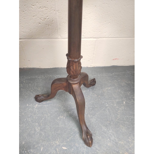 479 - Edwardian mahogany wine table, the lobed circular top on ring and leaf carved turned column with dow... 