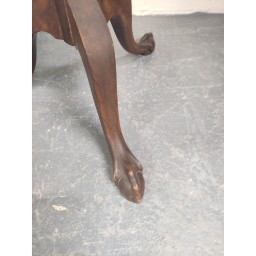 479 - Edwardian mahogany wine table, the lobed circular top on ring and leaf carved turned column with dow... 