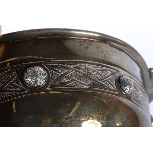 17 - Silver plated twin handle bowl in the form of a quaich with Celtic band decoration, 26.5cm wide.