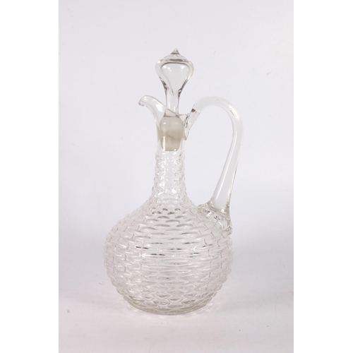 70 - Glass ewer with woven texture decoration to the main body, 29cm.