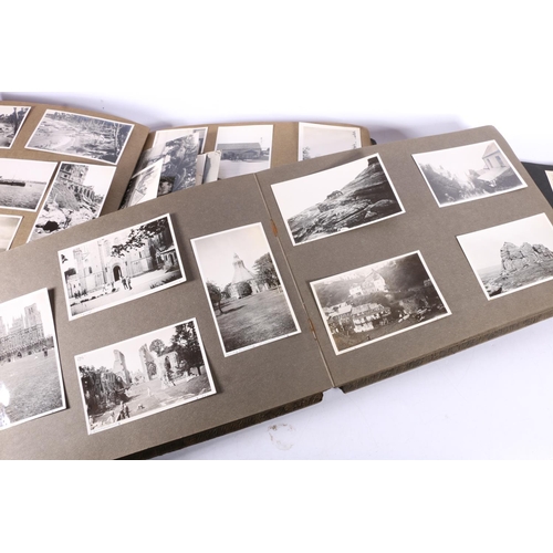 375 - Three albums containing a large quantity of black & white photographs, including India, France, ... 