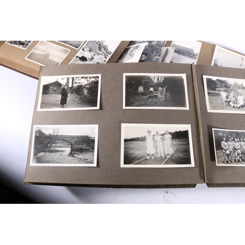 375 - Three albums containing a large quantity of black & white photographs, including India, France, ... 