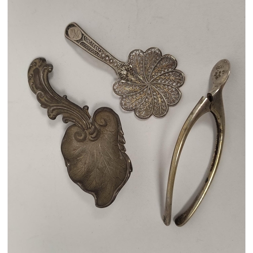 90 - Silver caddy spoon of scrolling vine leaf form, another filigree c1820 and a wishbone tongs, 1907. 3... 