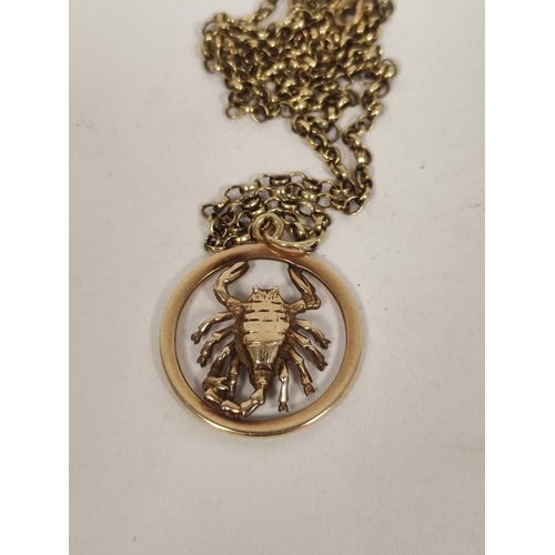 91 - 9ct gold Scorpion pendant with necklet, 12.8g and a silver ring. (2).