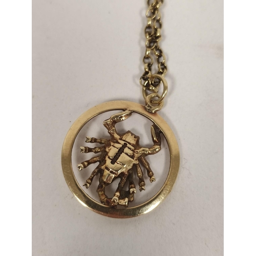 91 - 9ct gold Scorpion pendant with necklet, 12.8g and a silver ring. (2).