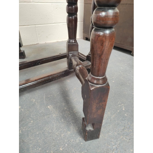 476 - 17th century oak oval small drop leaf dining table on turned baluster supports and understretchers. ... 