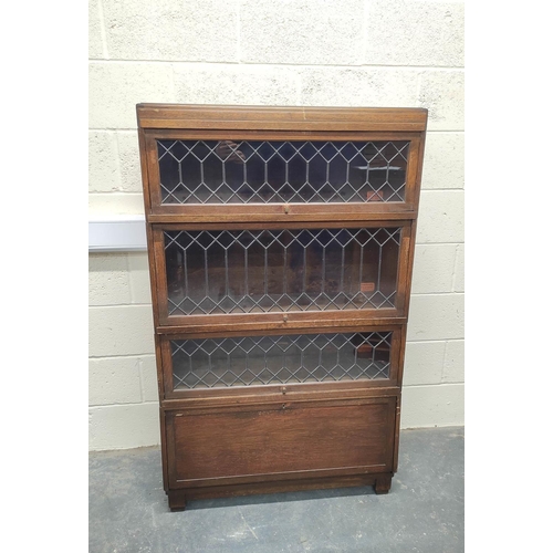 483 - Oak stacking bookcase by Globe Wernicke, the four sections with leaded glass doors, raised on base, ... 