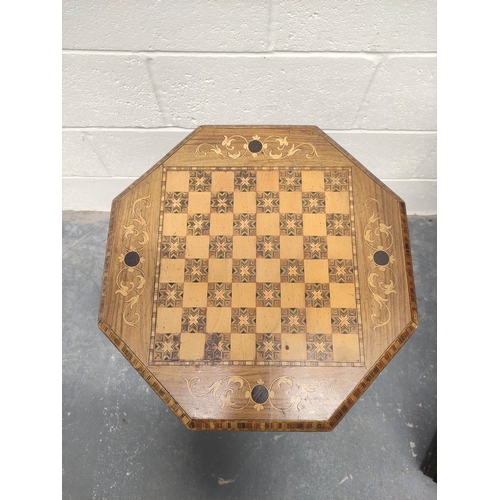 484 - Victorian inlaid walnut sewing table, the octagonal marquetry inlaid games top, enclosing side lined... 