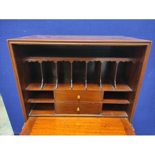 487 - Chippendale revival mahogany secretaire cabinet, with fall front door enclosing fitted pigeon holes ... 