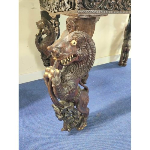 496 - 19th century Burmese carved hardwood hall table, the rectangular top with border and frieze of birds... 