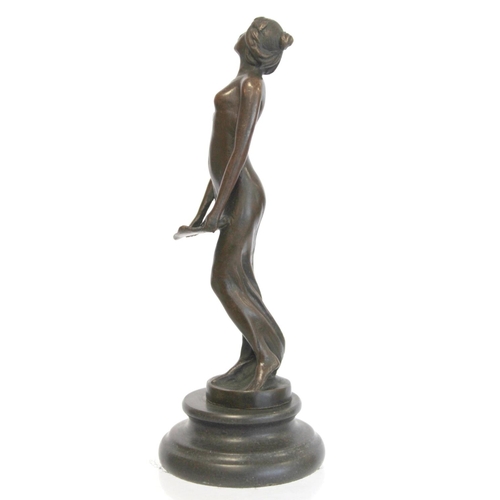 236 - Cast bronze figure of maiden in diaphanous dress holding a letter, on black slate, socle plinth base... 