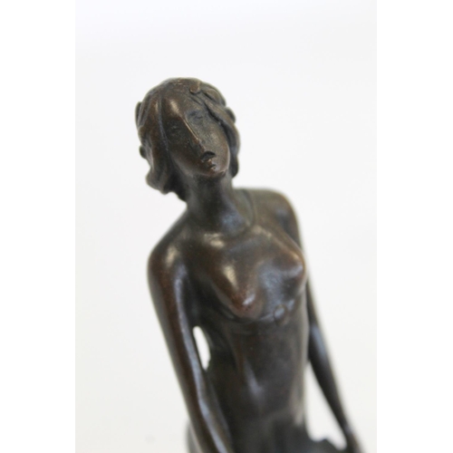 236 - Cast bronze figure of maiden in diaphanous dress holding a letter, on black slate, socle plinth base... 