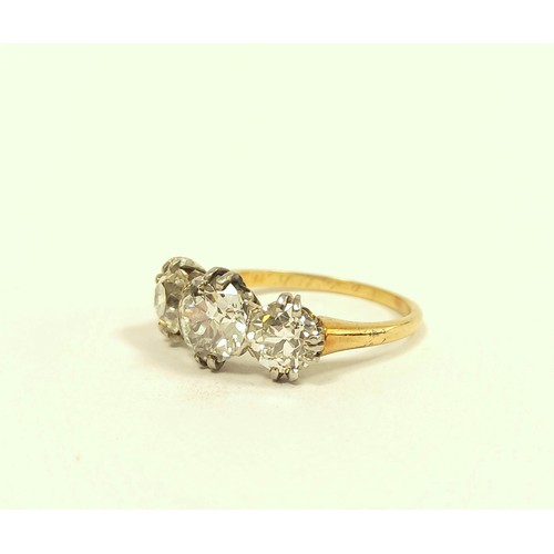 100 - Fine diamond three stone ring the central brilliant 8mm, (approximately 1.6ct), faceted girdle, flan... 