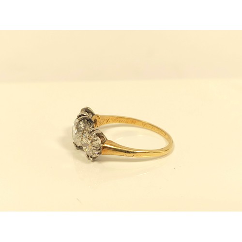 100 - Fine diamond three stone ring the central brilliant 8mm, (approximately 1.6ct), faceted girdle, flan... 