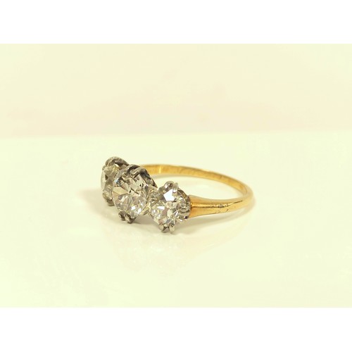 100 - Fine diamond three stone ring the central brilliant 8mm, (approximately 1.6ct), faceted girdle, flan... 