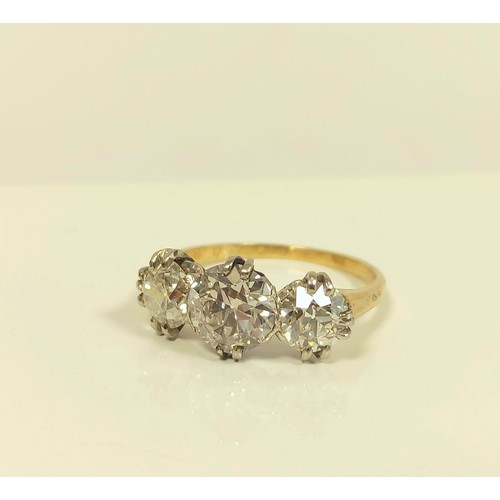 100 - Fine diamond three stone ring the central brilliant 8mm, (approximately 1.6ct), faceted girdle, flan... 