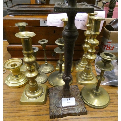 13 - Assortment of antique brass candlesticks.