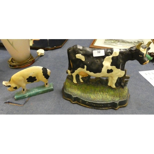 32 - Two cast iron modern door stops, one in the form of a cow and the other a pig.