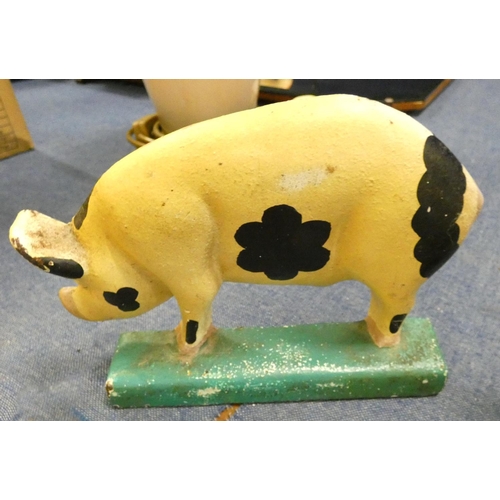 32 - Two cast iron modern door stops, one in the form of a cow and the other a pig.